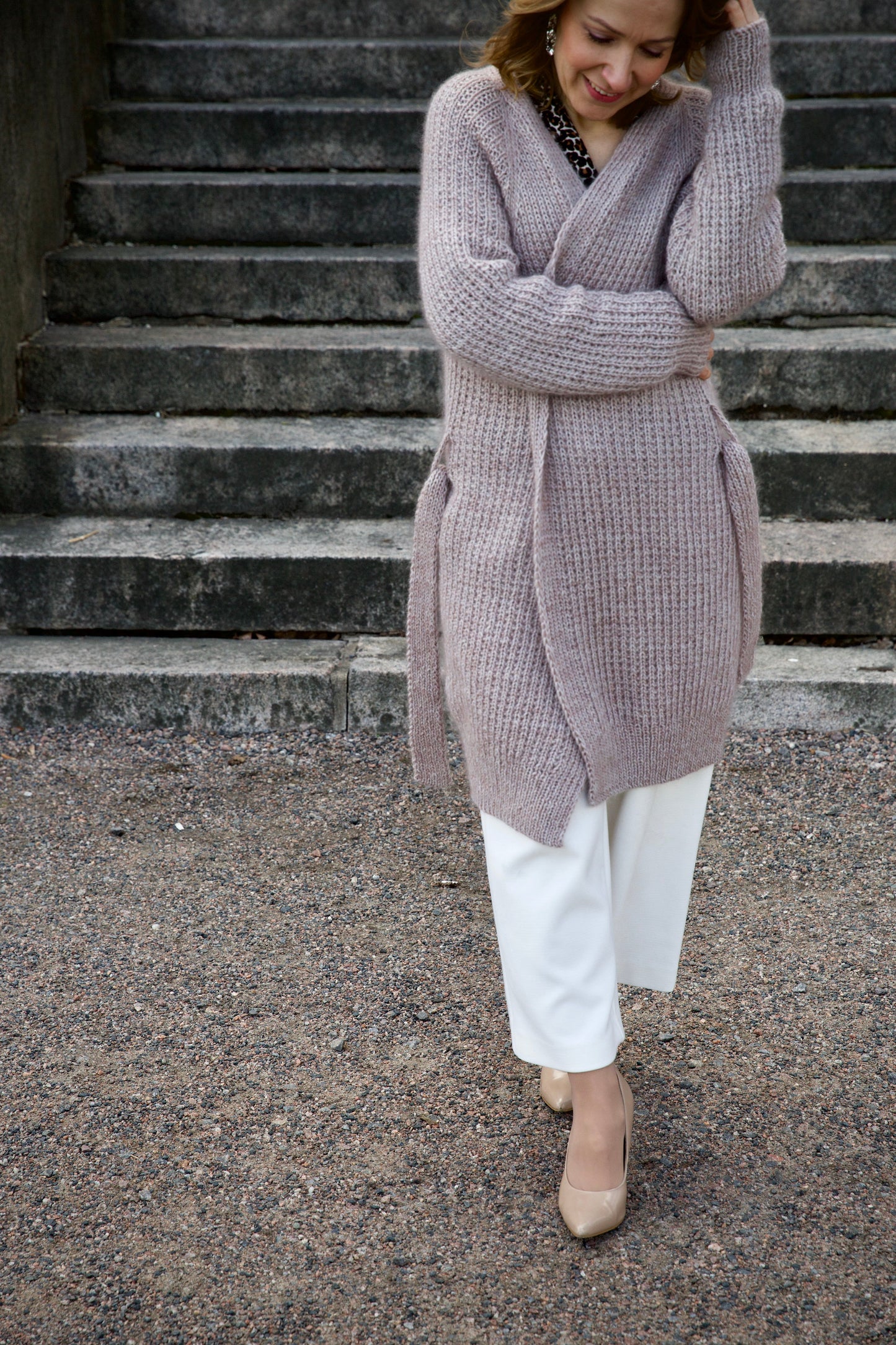 Long lavender cardigan knitting pattern, full-length, worn with white trousers